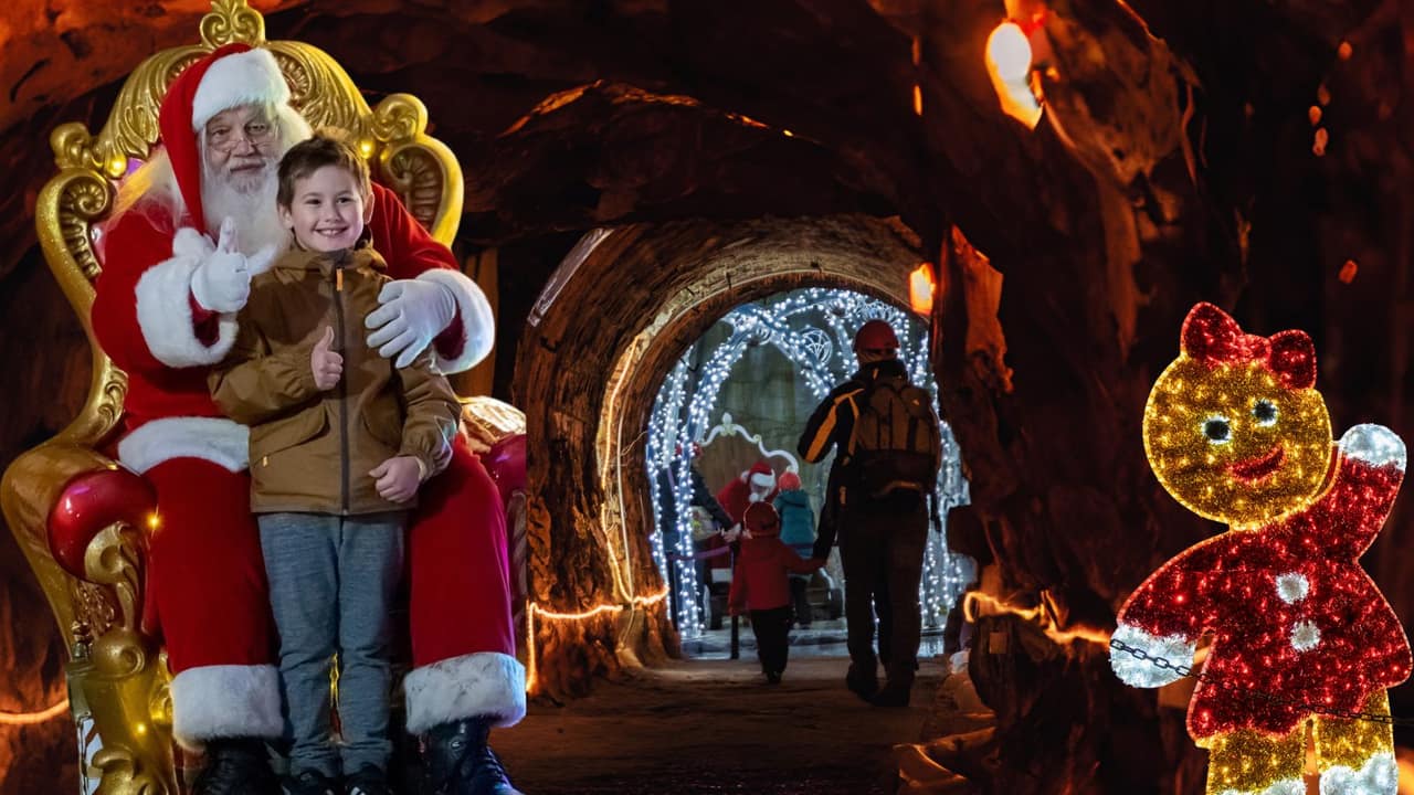 Bambino con Babbo Natale sul trono nella Grotta sotterranea di Ornavasso